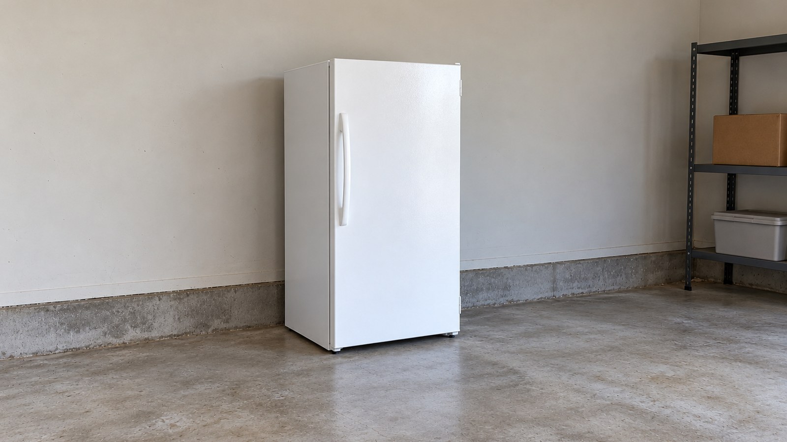 White single-door upright freezer in a daylight suburban garage